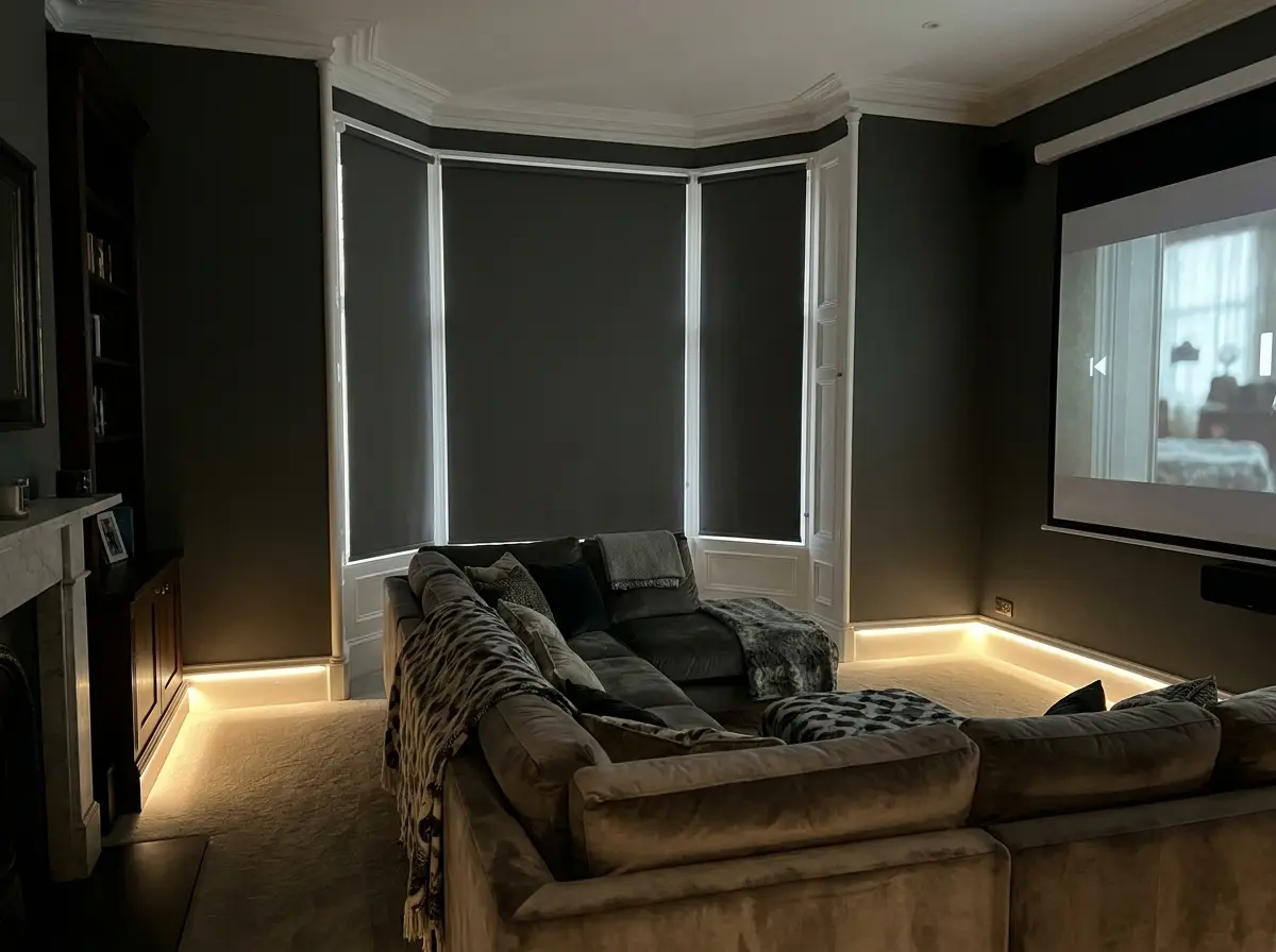Motorised block-out roller blind fully lowered in a Morningside home cinema room